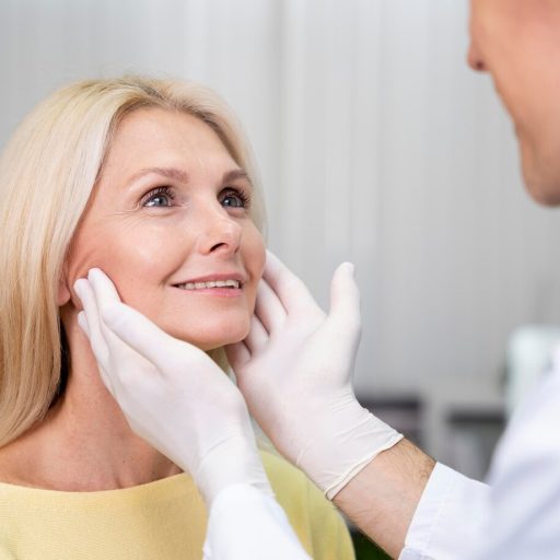 close-up-doctor-checking-patient_23-2149103552